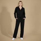 Kvinnor långärmat set med dragkedjetopp och byxor med vida ben