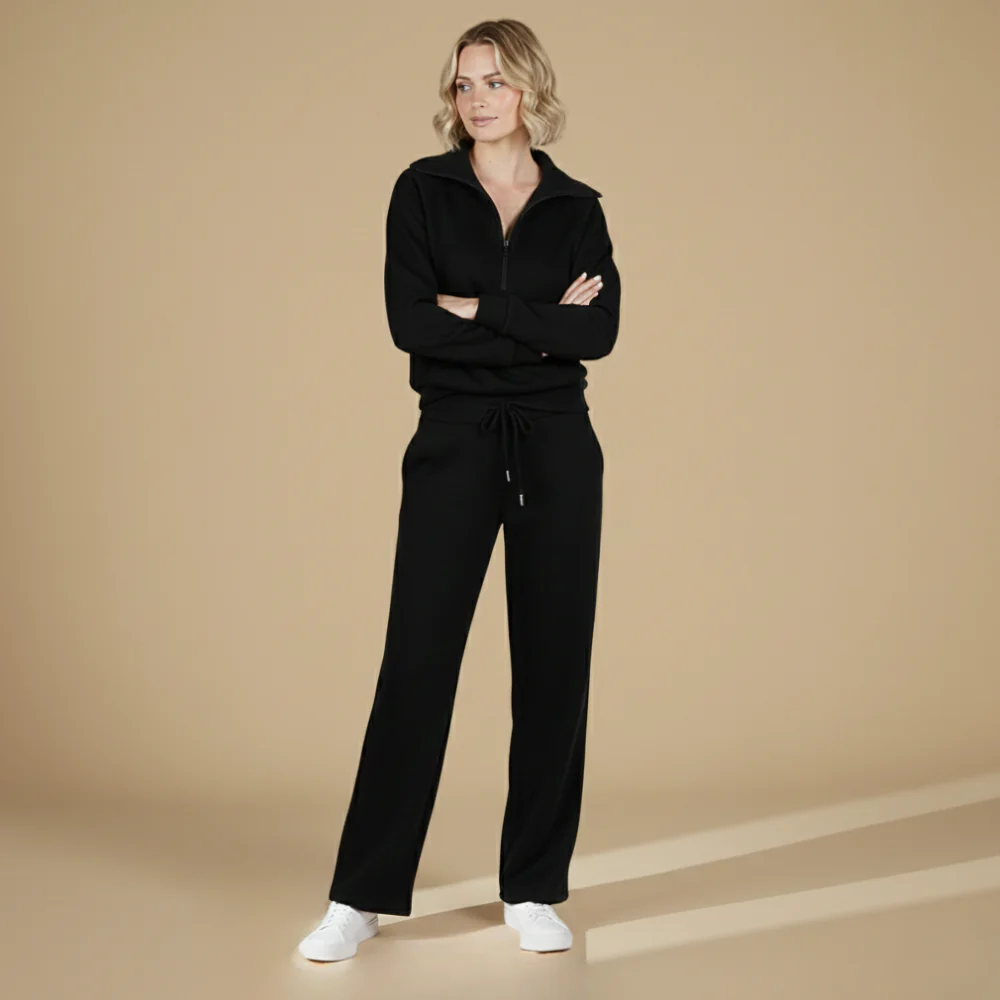 Kvinnor långärmat set med dragkedjetopp och byxor med vida ben